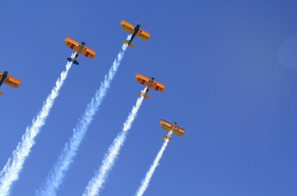 Five planes with their contrails